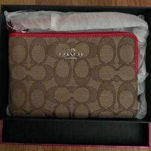 Brand new Coach red and brown wristlet